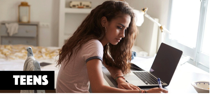 young woman doing homework at their desk