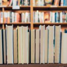 shelf of books with the non-spine side facing outward