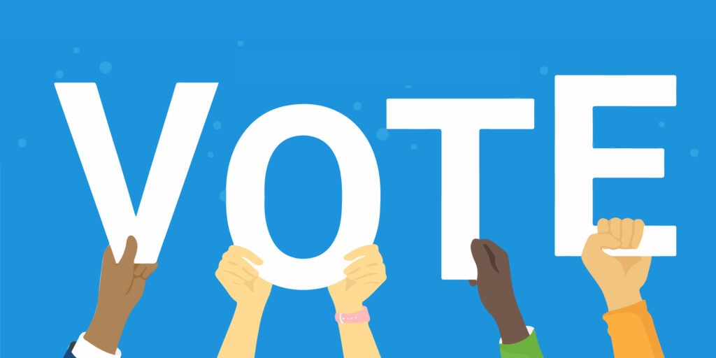 decorative image that says "VOTE" with the letters being held up by hands with various skin tones