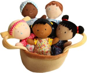 A basket of five multicultural cloth dolls.