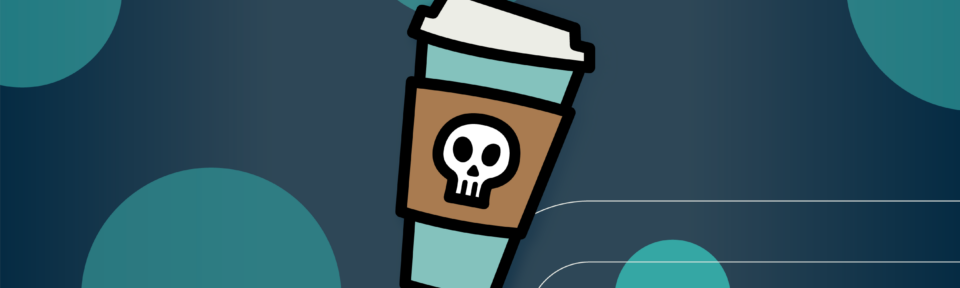 A to-go cup of coffee with a skull on the sleeve